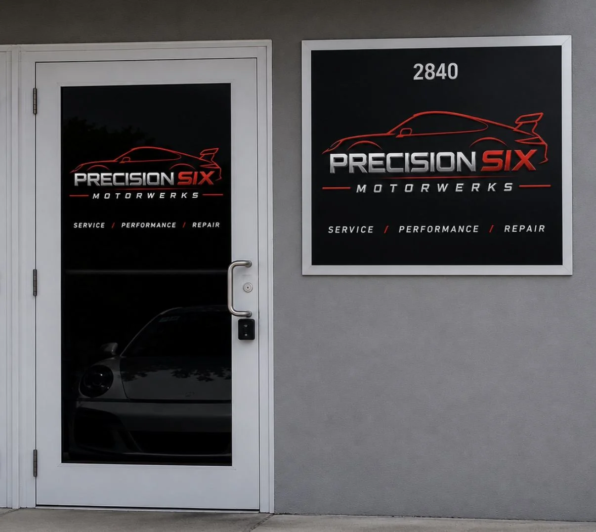 Storefront door and wall sign for Precision Six Motorwerks with red and silver logo lettering