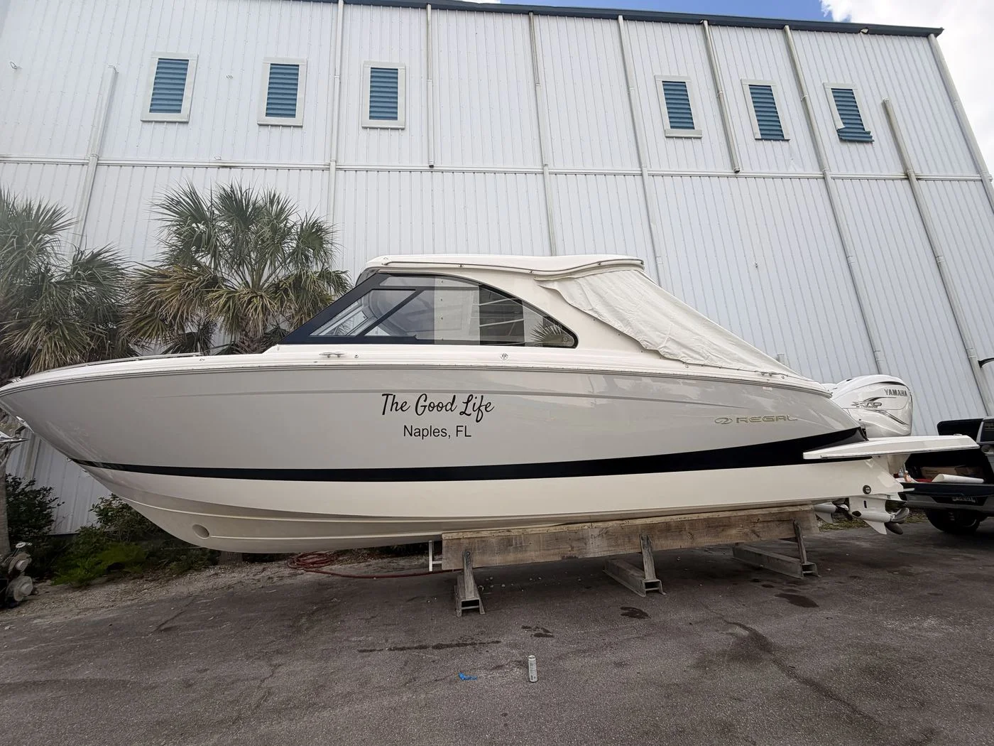Regal boat named The Good Life, Naples FL, with custom script vinyl lettering on the hull