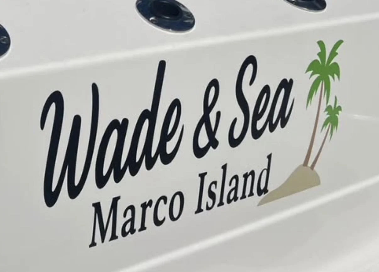 Custom boat name lettering reading Wade & Sea, Marco Island, with a palm tree island graphic